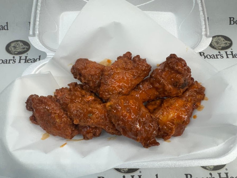 Sauced chicken wings on Boar’s Head paper